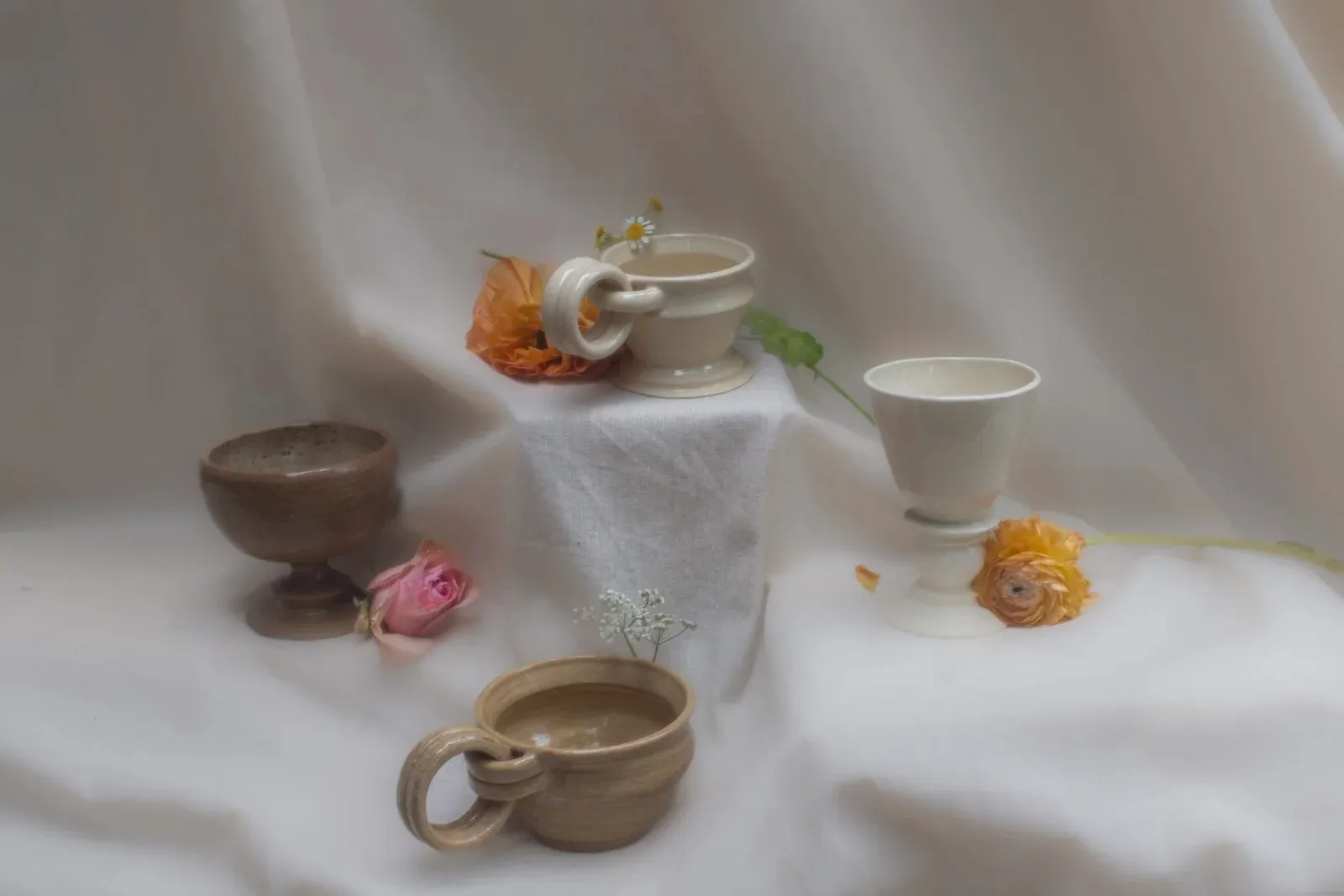 Four vessels on bone linen — the true photograph beneath the sediment